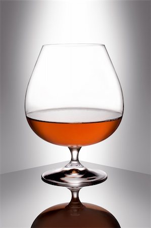 Snifter glass of cognac on white background. Stock Photo - Budget Royalty-Free & Subscription, Code: 400-05131674