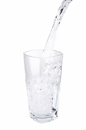 water being poured into a glass on white background. Stock Photo - Budget Royalty-Free & Subscription, Code: 400-05131676