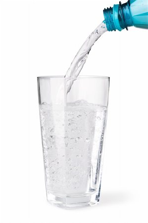 Water being poured into a glass on white background. Stock Photo - Budget Royalty-Free & Subscription, Code: 400-05131678