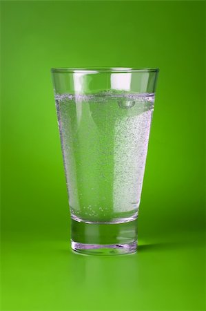 A glass of sparkling mineral water on green background. Stock Photo - Budget Royalty-Free & Subscription, Code: 400-05131679