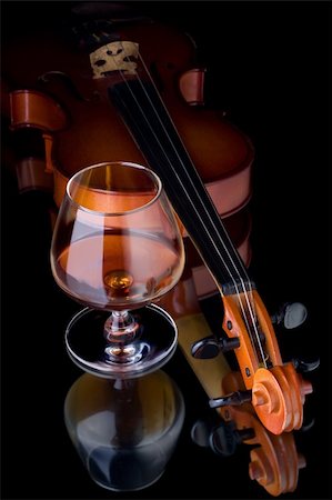 Snifter glass of cognac and violin Stock Photo - Budget Royalty-Free & Subscription, Code: 400-05131689
