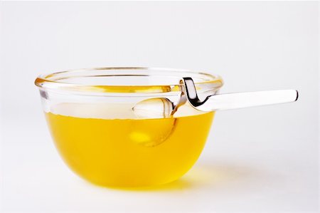 Thick sweet honey and into the small honey pot Stock Photo - Budget Royalty-Free & Subscription, Code: 400-05131683