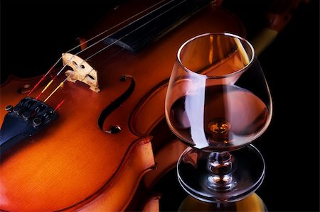 Snifter glass of cognac and violin Stock Photo - Budget Royalty-Free & Subscription, Code: 400-05131690