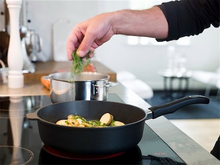 Man working with food in a elegant enviroment. Stock Photo - Budget Royalty-Free & Subscription, Code: 400-05131888