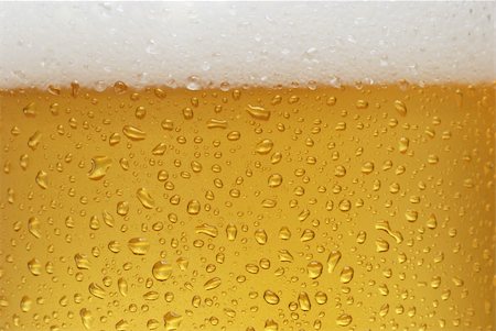 simsearch:400-04644670,k - Glass of beer close-up with froth over  background Fotografie stock - Microstock e Abbonamento, Codice: 400-05131941