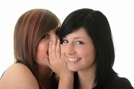 simsearch:400-03926791,k - Two happy young girlfriends (sisters) talking over white Stockbilder - Microstock & Abonnement, Bildnummer: 400-05132350