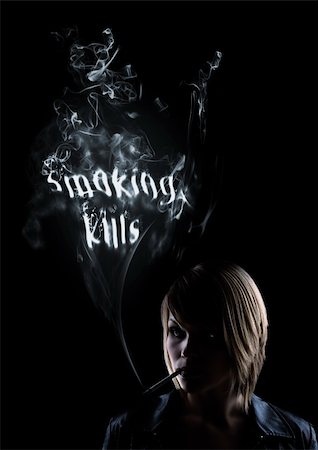 young women smokes and in the smoke appear the words "Smoking Kills" Stock Photo - Budget Royalty-Free & Subscription, Code: 400-05132403