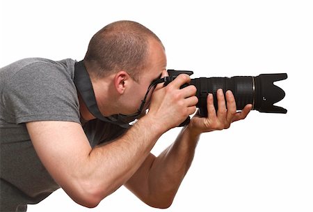 paparazzi taking pictures of man background - fine portrait of young photographer caucasian man on white background Photographie de stock - Aubaine LD & Abonnement, Code: 400-05132501