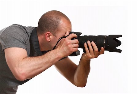 paparazzi taking pictures of man background - fine portrait of young photographer caucasian man on white background Photographie de stock - Aubaine LD & Abonnement, Code: 400-05132502