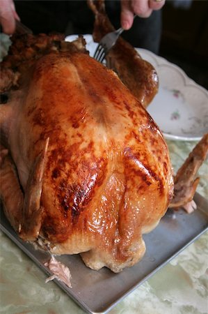 A fully stuffed turkey, being carved. Fotografie stock - Microstock e Abbonamento, Codice: 400-05132598