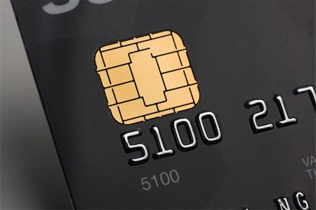 sim card - Closeup of a credit card with a gold chip Stock Photo - Budget Royalty-Free & Subscription, Code: 400-05132652
