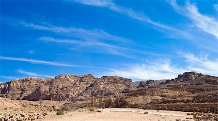 simsearch:400-05132743,k - Jordan Petra desert panorama with a  toms in the distance and blue sky above. Roman temple in front Photographie de stock - Aubaine LD & Abonnement, Code: 400-05132748