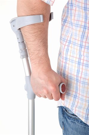 man walking with a crutch against white background Stock Photo - Budget Royalty-Free & Subscription, Code: 400-05132927