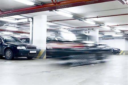 The shined underground garage with the moving cars and parked cars Stock Photo - Budget Royalty-Free & Subscription, Code: 400-05133496