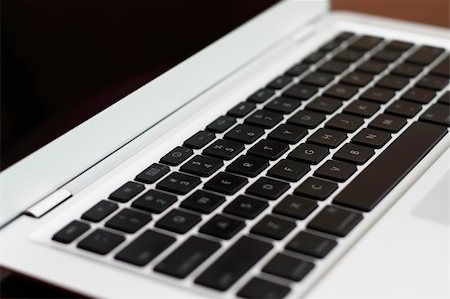 A silver colored super-slim laptop computer. Stock Photo - Budget Royalty-Free & Subscription, Code: 400-05133895