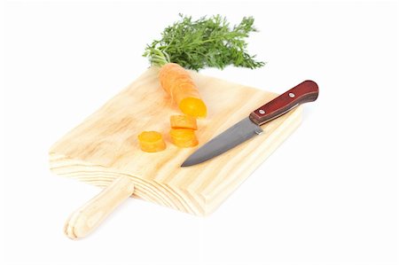 simsearch:400-03964348,k - Slices of fresh carrots and knife on plate wooden. Shallow depth of field Stockbilder - Microstock & Abonnement, Bildnummer: 400-05133905