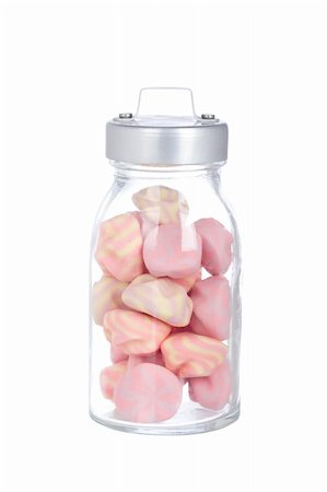 simsearch:400-04781520,k - Pink marshmallows in the glass jar, isolated on white background Photographie de stock - Aubaine LD & Abonnement, Code: 400-05133911