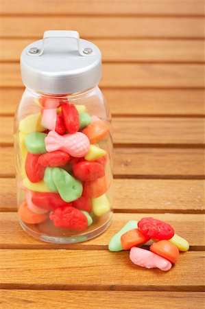 simsearch:400-04781520,k - Colorful candies in the glass jar on wooden background Photographie de stock - Aubaine LD & Abonnement, Code: 400-05133913
