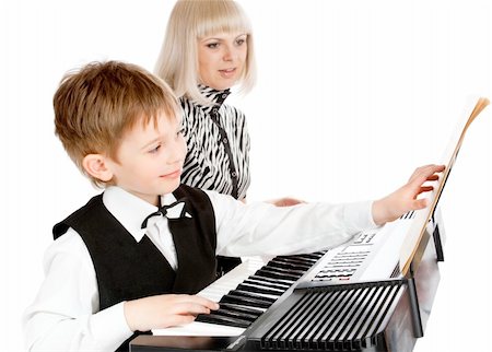 synthesizer - Mother and her preschool son playing electric piano Stock Photo - Budget Royalty-Free & Subscription, Code: 400-05144165