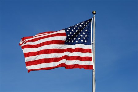 simsearch:400-08998198,k - American flag waving against blue sky Foto de stock - Super Valor sin royalties y Suscripción, Código: 400-05144457