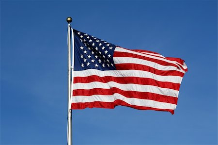 simsearch:400-08998198,k - American flag waving against blue sky Foto de stock - Super Valor sin royalties y Suscripción, Código: 400-05144458