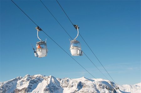 simsearch:400-04588712,k - Ski lift cabins against clear blue sky Stock Photo - Budget Royalty-Free & Subscription, Code: 400-05144948