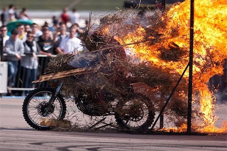 Stunt rider riding through a wall of flames Stock Photo - Budget Royalty-Free & Subscription, Code: 400-05145358