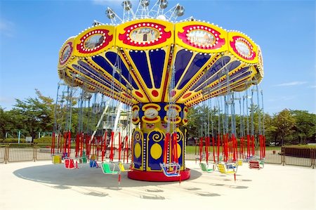Colorful carousel in atraction park Stock Photo - Budget Royalty-Free & Subscription, Code: 400-05145441