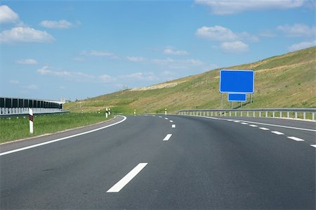 simsearch:400-05242063,k - Empty highway lanes bending view from close Photographie de stock - Aubaine LD & Abonnement, Code: 400-05146043