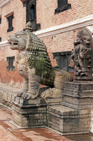 Statue of mythical beast guarding the entrance to the Royal Palace in the Durbar Square, Bhaktapur, Nepal Stock Photo - Budget Royalty-Free & Subscription, Code: 400-05146086