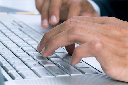 ertekmali (artist) - Close-up of a businessman's hands typing on the keyboard Stockbilder - Microstock & Abonnement, Bildnummer: 400-05146152