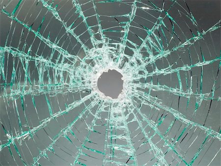 There is a broken car glass of windscreen with hole in picture center Stockbilder - Microstock & Abonnement, Bildnummer: 400-05146684