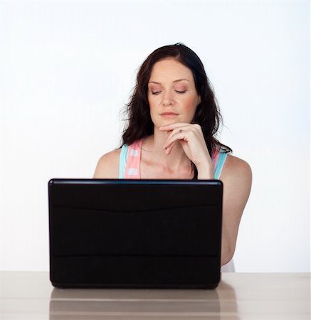 simsearch:400-05729276,k - Serious young woman working with her laptop Stock Photo - Budget Royalty-Free & Subscription, Code: 400-05147051