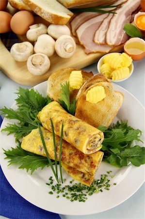 simsearch:400-05255035,k - Delicious rolled mushroom and bacon omelette freshly prepared and ready to serve. Stock Photo - Budget Royalty-Free & Subscription, Code: 400-05147621