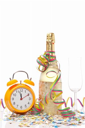 simsearch:400-05082002,k - Champagne glass ready to bring in the New Year, with clock, ribbons and confetti Photographie de stock - Aubaine LD & Abonnement, Code: 400-05148135