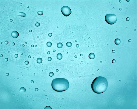 simsearch:400-04617126,k - Water droplets on transparent blue surface Fotografie stock - Microstock e Abbonamento, Codice: 400-05148409