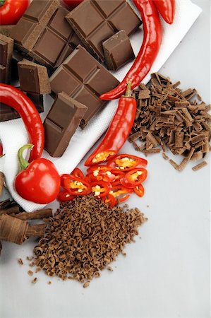 dark chocolate curl - Delicious dark chocolate with a selection of different chilies and peppers. Stock Photo - Budget Royalty-Free & Subscription, Code: 400-05148636