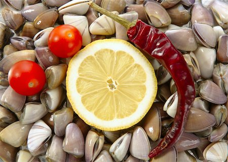 simsearch:400-04406446,k - Clams with tomato, chili and lemon, seafood from mediterranean Stock Photo - Budget Royalty-Free & Subscription, Code: 400-05149257