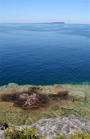 simsearch:400-05150811,k - The view from a top the cliffs at Georgian Bay in  Bruce Pennisula National Park in Ontario, Canada. Stock Photo - Budget Royalty-Free & Subscription, Code: 400-05140036