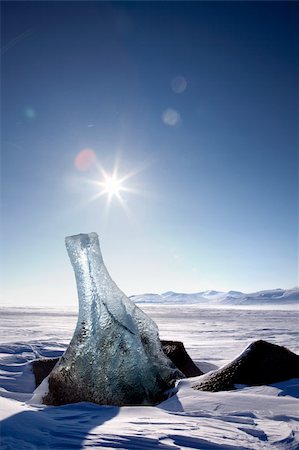 A piece of glacier ice sticking out of the frozen ocean, Spitsbergen, Svalbard, Norway Stock Photo - Budget Royalty-Free & Subscription, Code: 400-05140120
