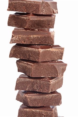 simsearch:400-05149272,k - Blocks of chocolate isolated on white background. Shallow depth of field Stock Photo - Budget Royalty-Free & Subscription, Code: 400-05140294