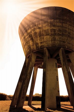 rusting tank - a water tower in the irish countryside on a hot day with a white background in sepia Stock Photo - Budget Royalty-Free & Subscription, Code: 400-05140718