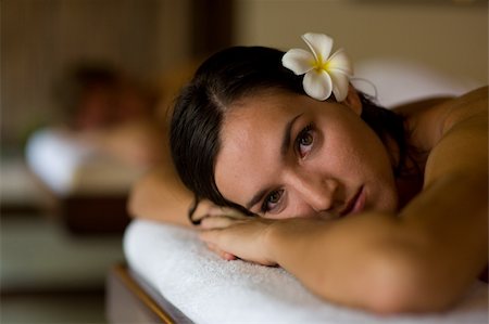 eastwestimaging (artist) - A young woman lying ready for massage in tropical spa Fotografie stock - Microstock e Abbonamento, Codice: 400-05140846