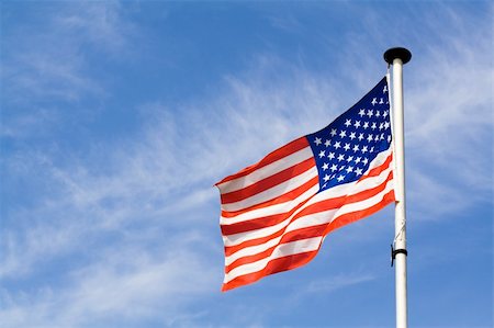 simsearch:400-05902840,k - Waving american flag on blue sky background Foto de stock - Royalty-Free Super Valor e Assinatura, Número: 400-05140919