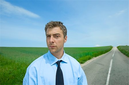 young businessman is stadning at the road ahead Stock Photo - Budget Royalty-Free & Subscription, Code: 400-05141270