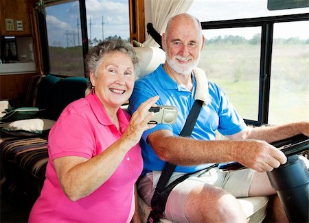 Senior couple using a GPS to navigate their motor home on the road. Foto de stock - Super Valor sin royalties y Suscripción, Código: 400-05141827
