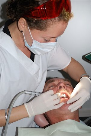 simsearch:400-04311636,k - The Medical treatment at the dentist office Foto de stock - Royalty-Free Super Valor e Assinatura, Número: 400-05141913