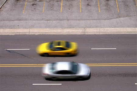 simsearch:400-04701684,k - Two cars passing in blurred motion. Stock Photo - Budget Royalty-Free & Subscription, Code: 400-05142880