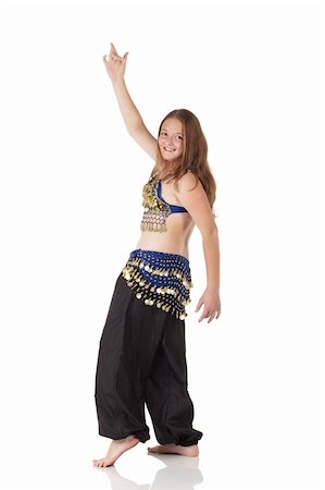 Young Caucasian belly dancing girl in beautiful decorated clothes on white background and reflective floor. Not isolated Stock Photo - Budget Royalty-Free & Subscription, Code: 400-05154709