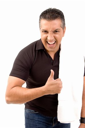 sweaty look of determination - Thumbs-up symbol by fit man Stock Photo - Budget Royalty-Free & Subscription, Code: 400-05155148